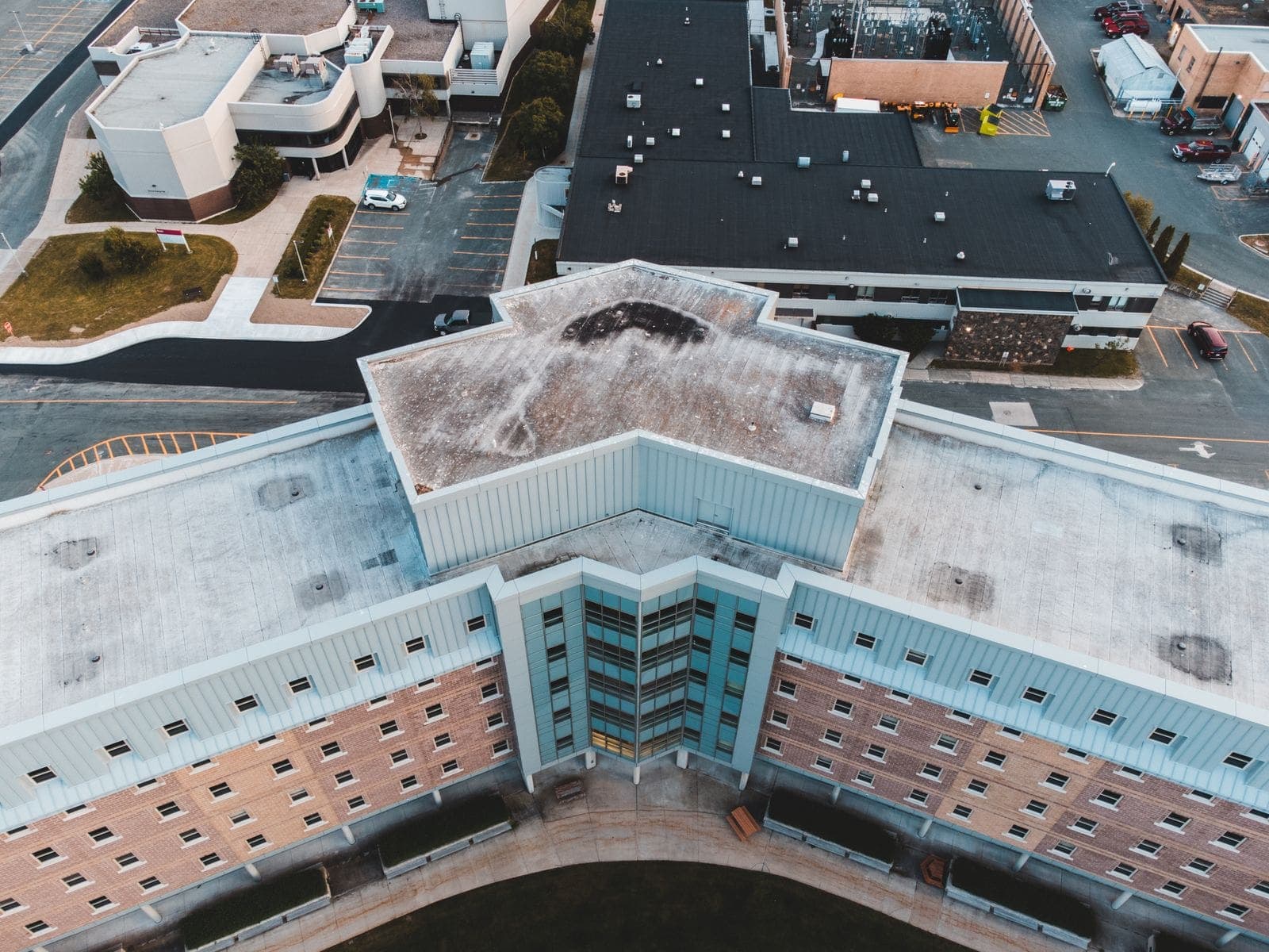 Aerial view of flat membrane roofs on commercial buildings